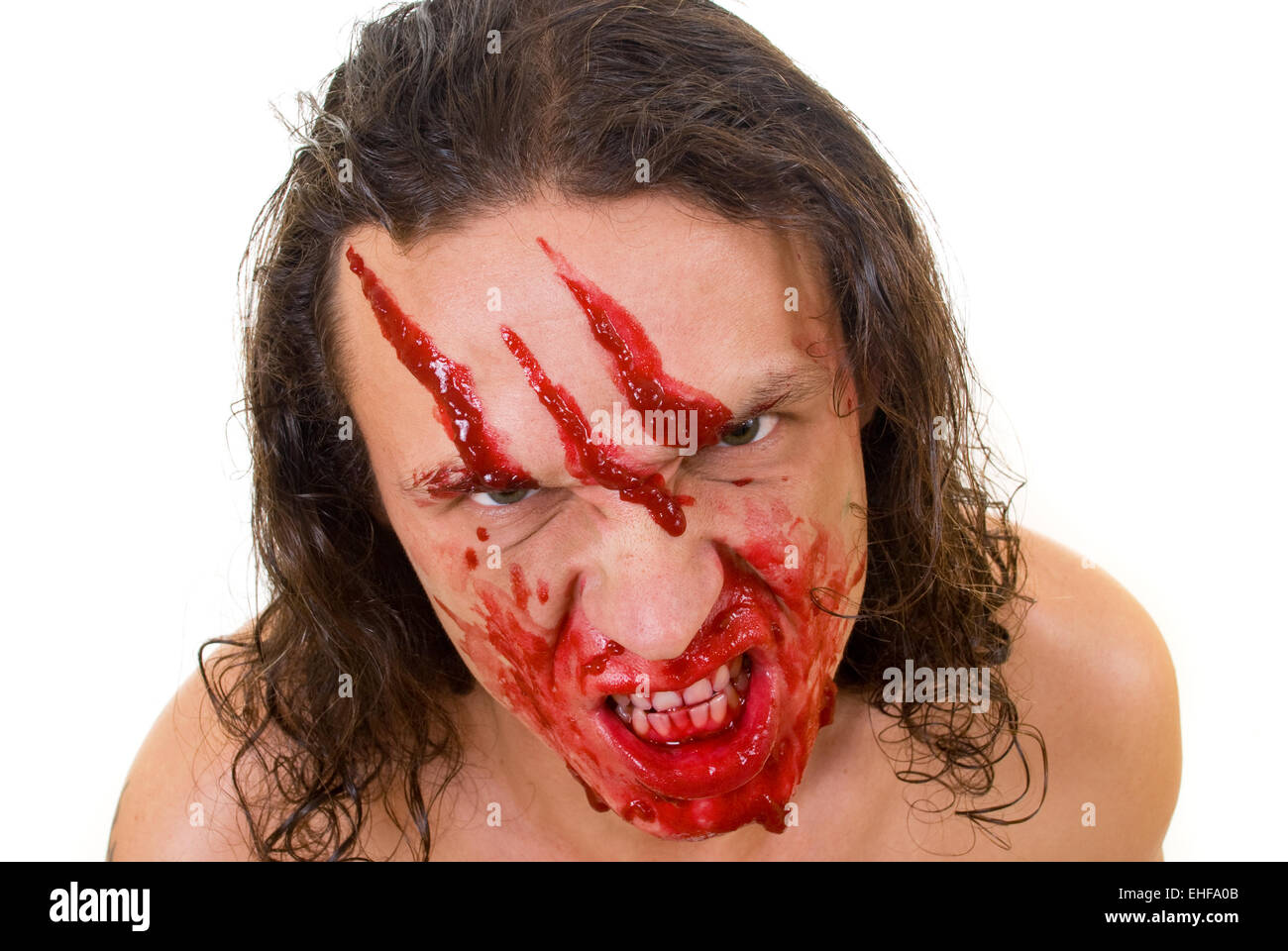 Kannibale-Maniac mit Blut im Gesicht Stockfoto