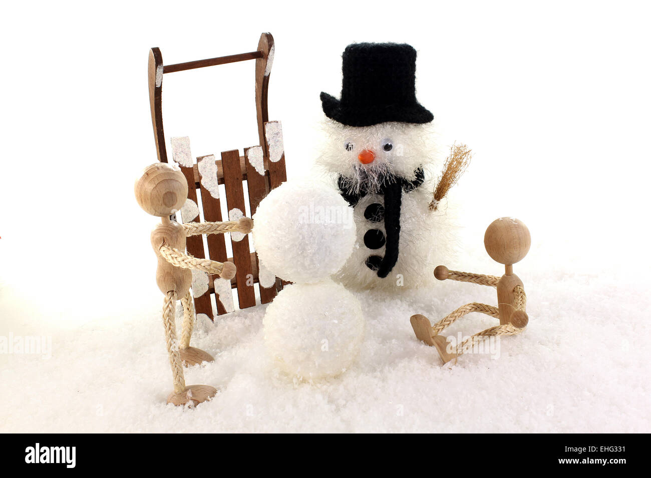 Childs Biuld einen Schneemann Stockfoto