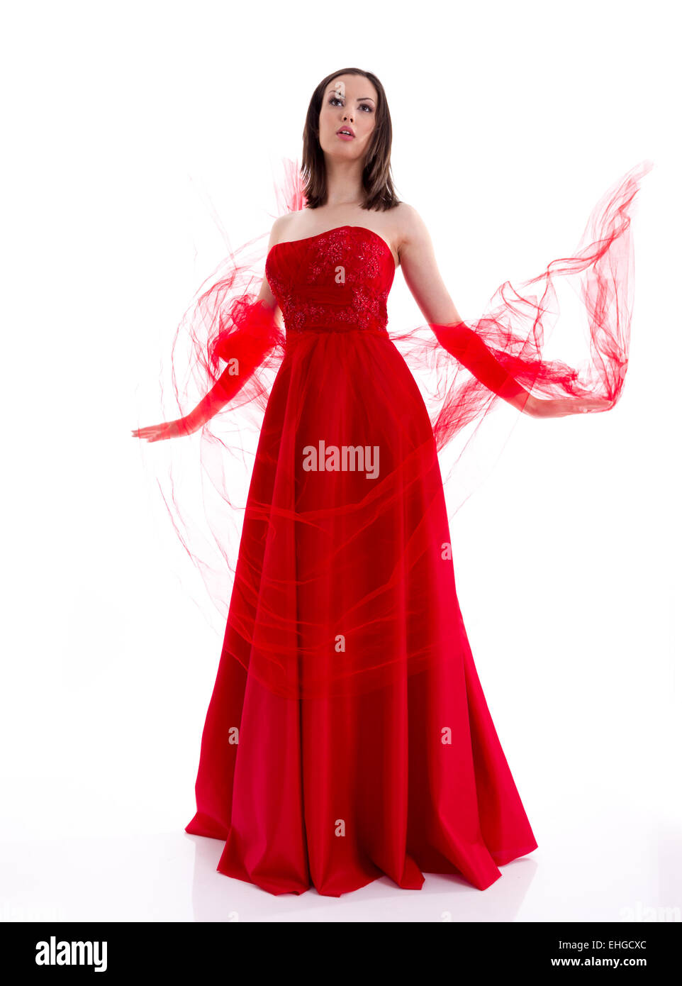 Schöne Frau in einem roten Kleid posieren für ein Foto-Shooting Stockfoto