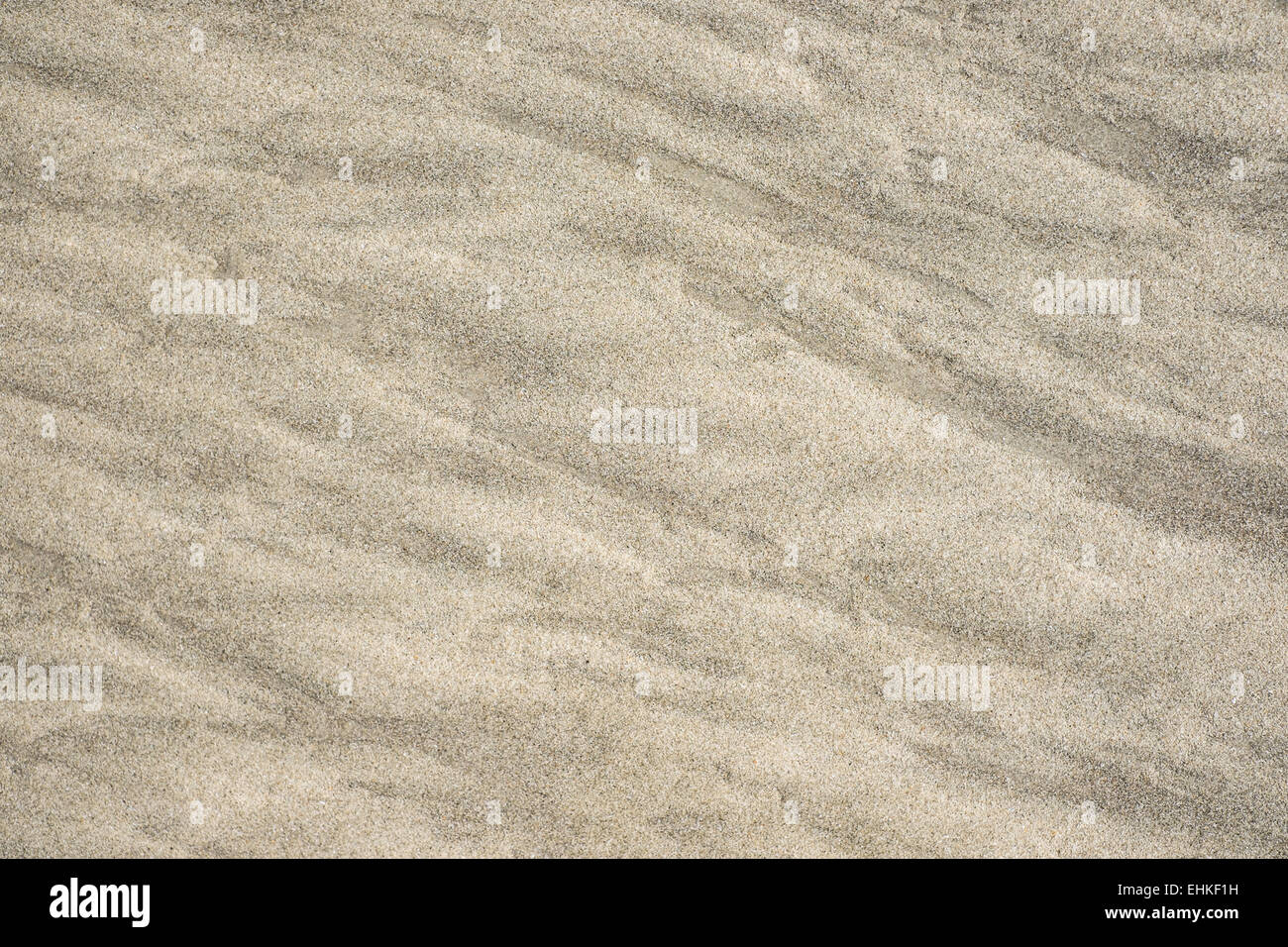 Texturen aus Sand am Strand, mit Mustern, die durch das Meer gemacht. Stockfoto