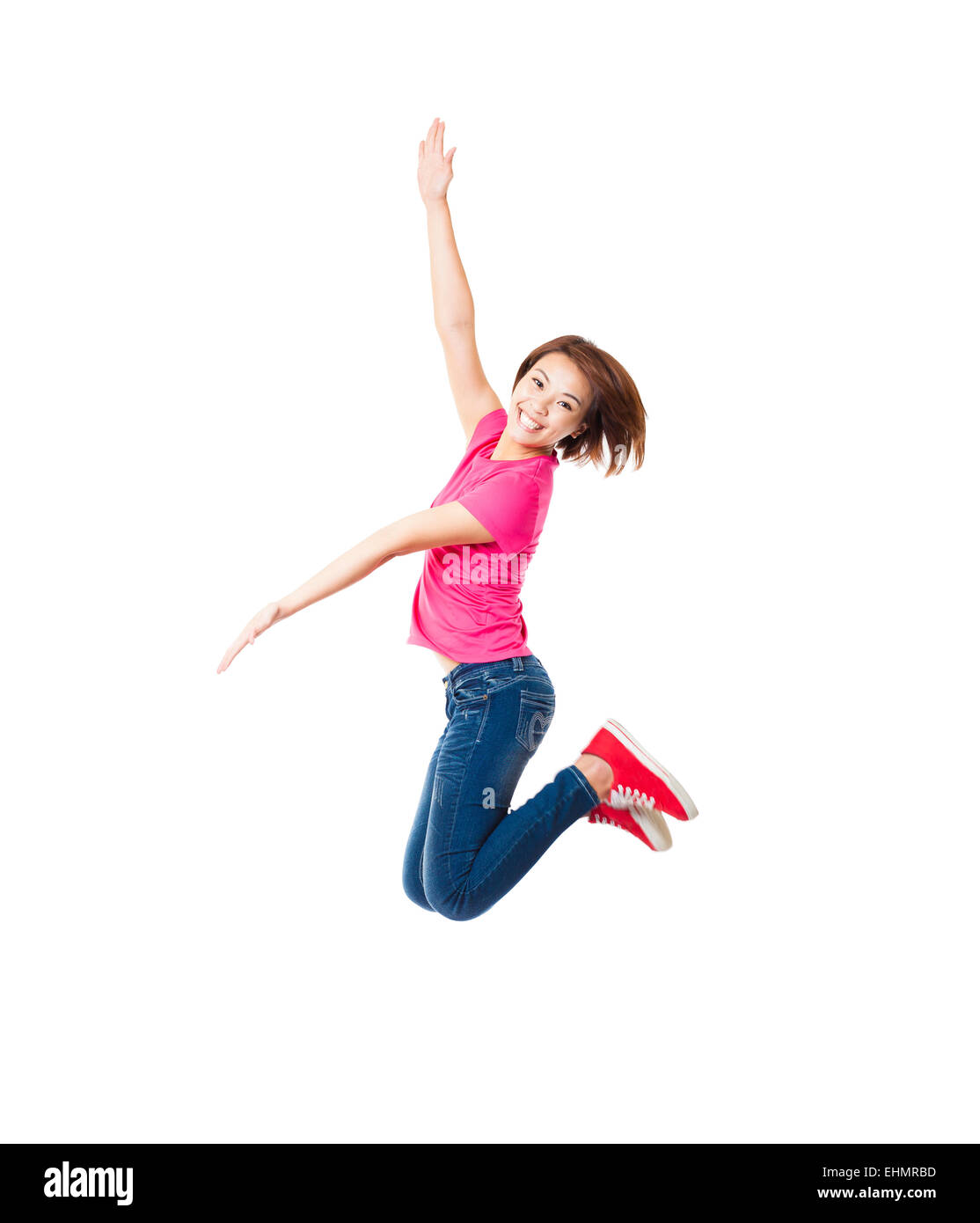 Glückliche Mädchen und Schüler springen Stockfoto