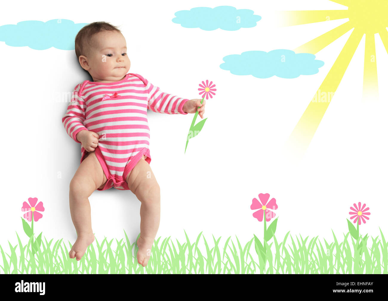 Lustige kleine Baby mit gezeichneten Blume auf der Wiese Stockfoto