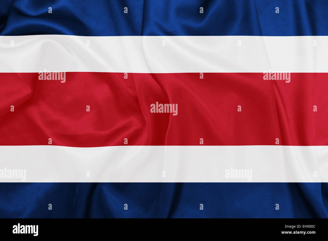Costa Rica - winken Nationalflagge auf Seide Textur Stockfoto