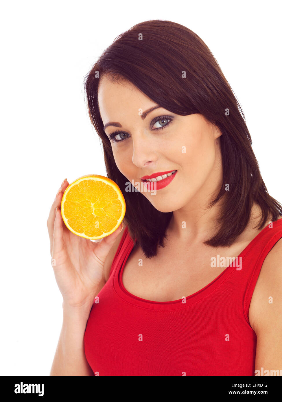 Junge attraktive Frau mit einer Orange Stockfoto