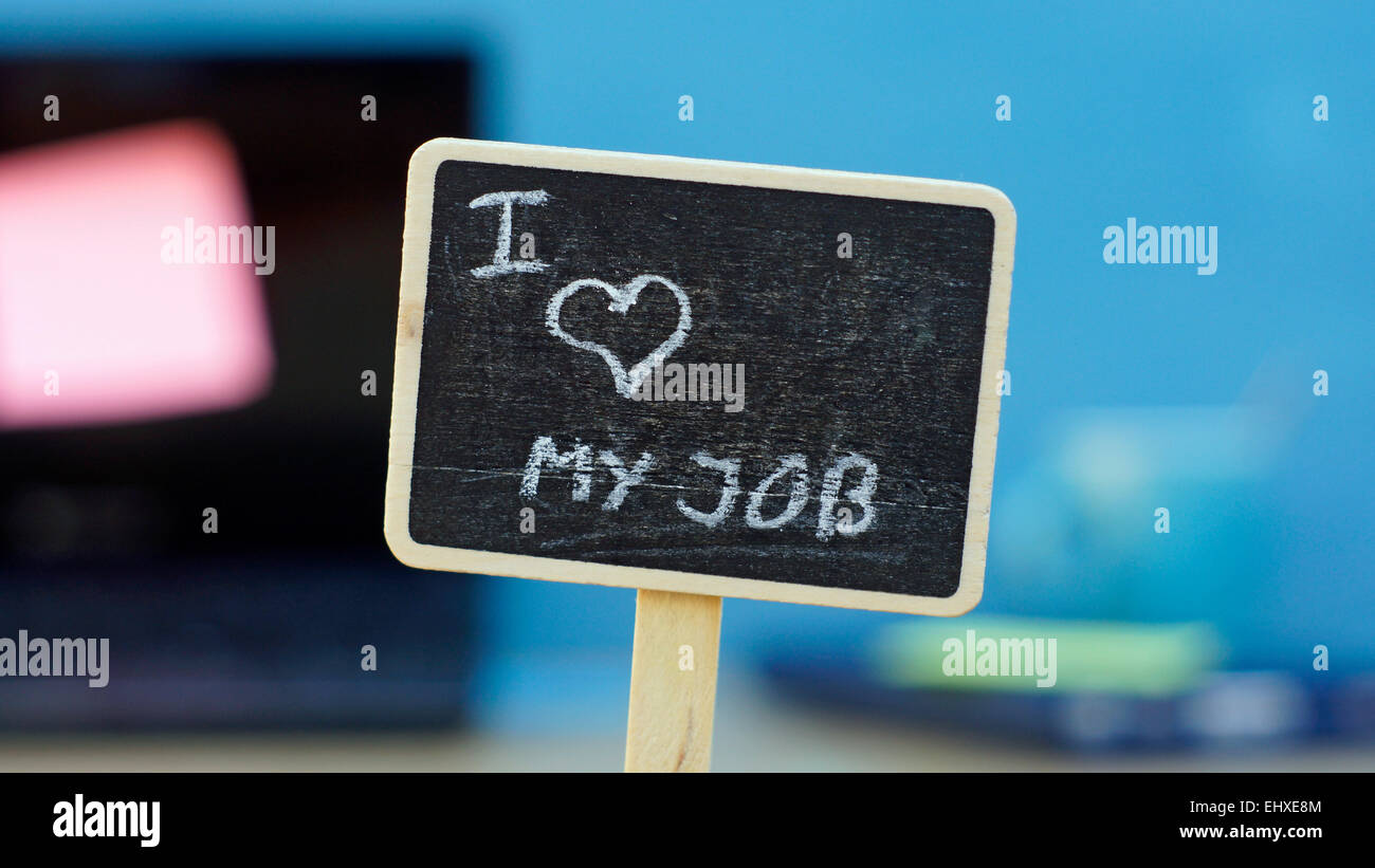 Ich liebe meinen Job, geschrieben auf einer Tafel im Hintergrund eine Büro Stockfoto
