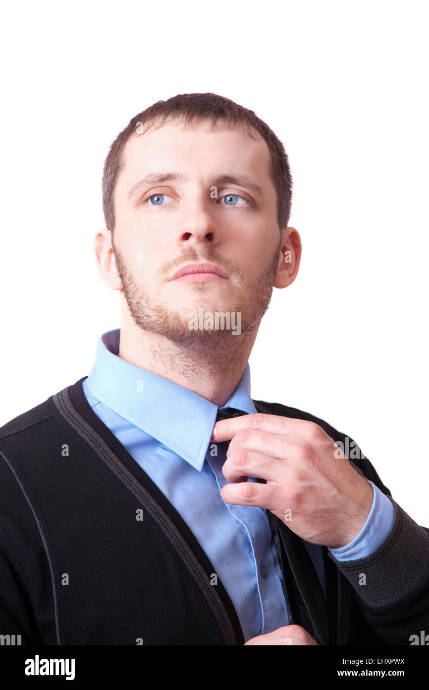 Attraktive Business-Mann richtet seine Krawatte isoliert auf weißem Hintergrund Stockfoto