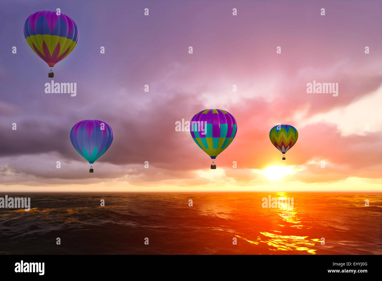 Bunte Heißluftballons über Meer bei Sonnenuntergang Stockfoto