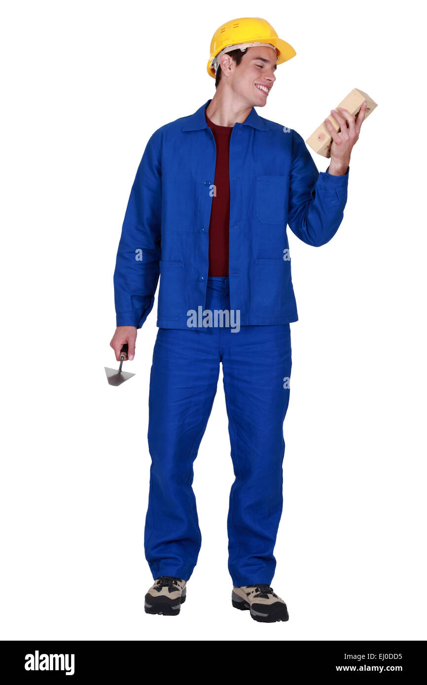 Junge Maurer in Overall Stockfoto Junge Maurer in Overall Stockfoto