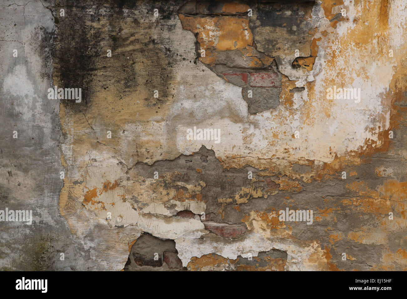 Alte Mauer mit rissigen Putz. Hintergrundtextur. Stockfoto
