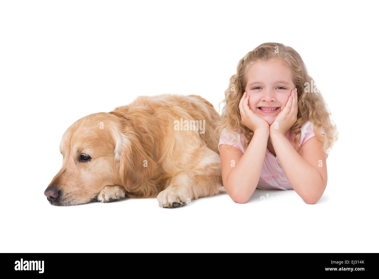 Mädchen und Hund auf dem Boden liegend Stockfoto