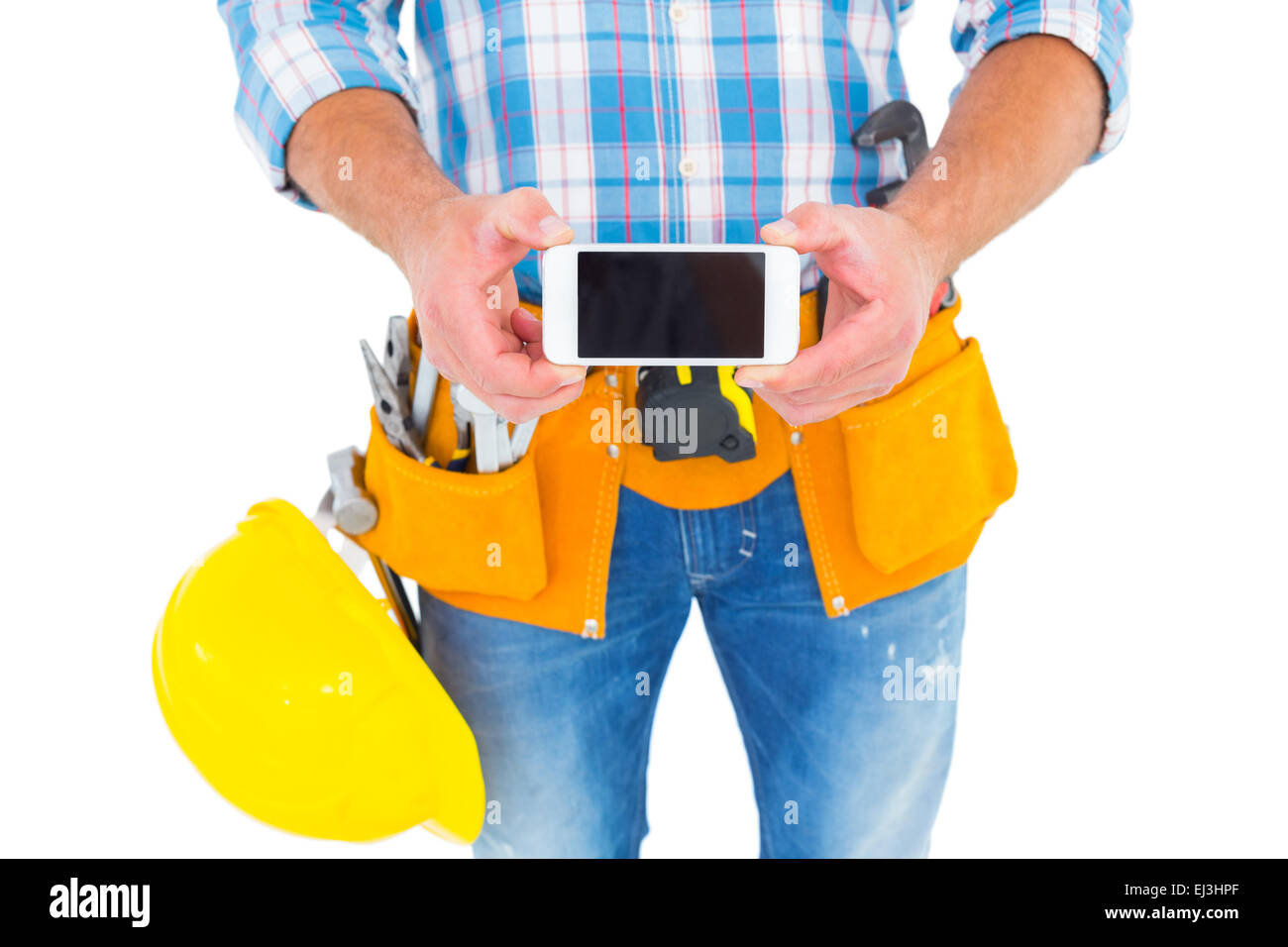 Mittelteil der Mechaniker mit Handy Stockfoto