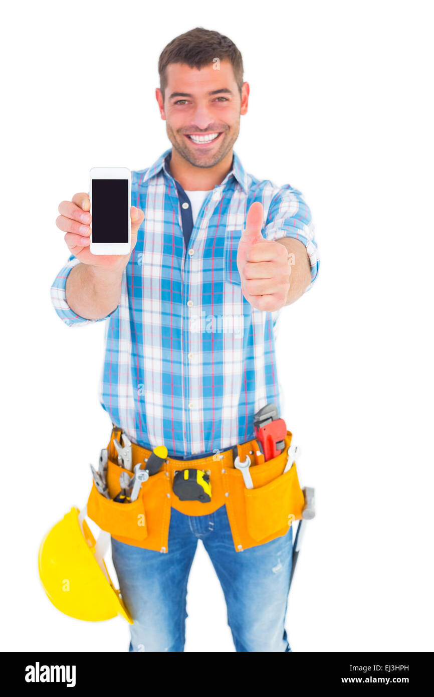 Glücklich Handwerker zeigen Handy weißen gestikulieren Daumen hoch Stockfoto