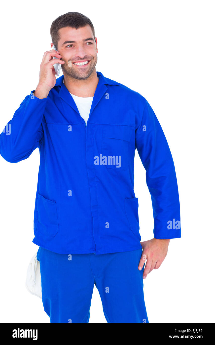 Lächelnde männlichen Mechaniker mit Handy Stockfoto