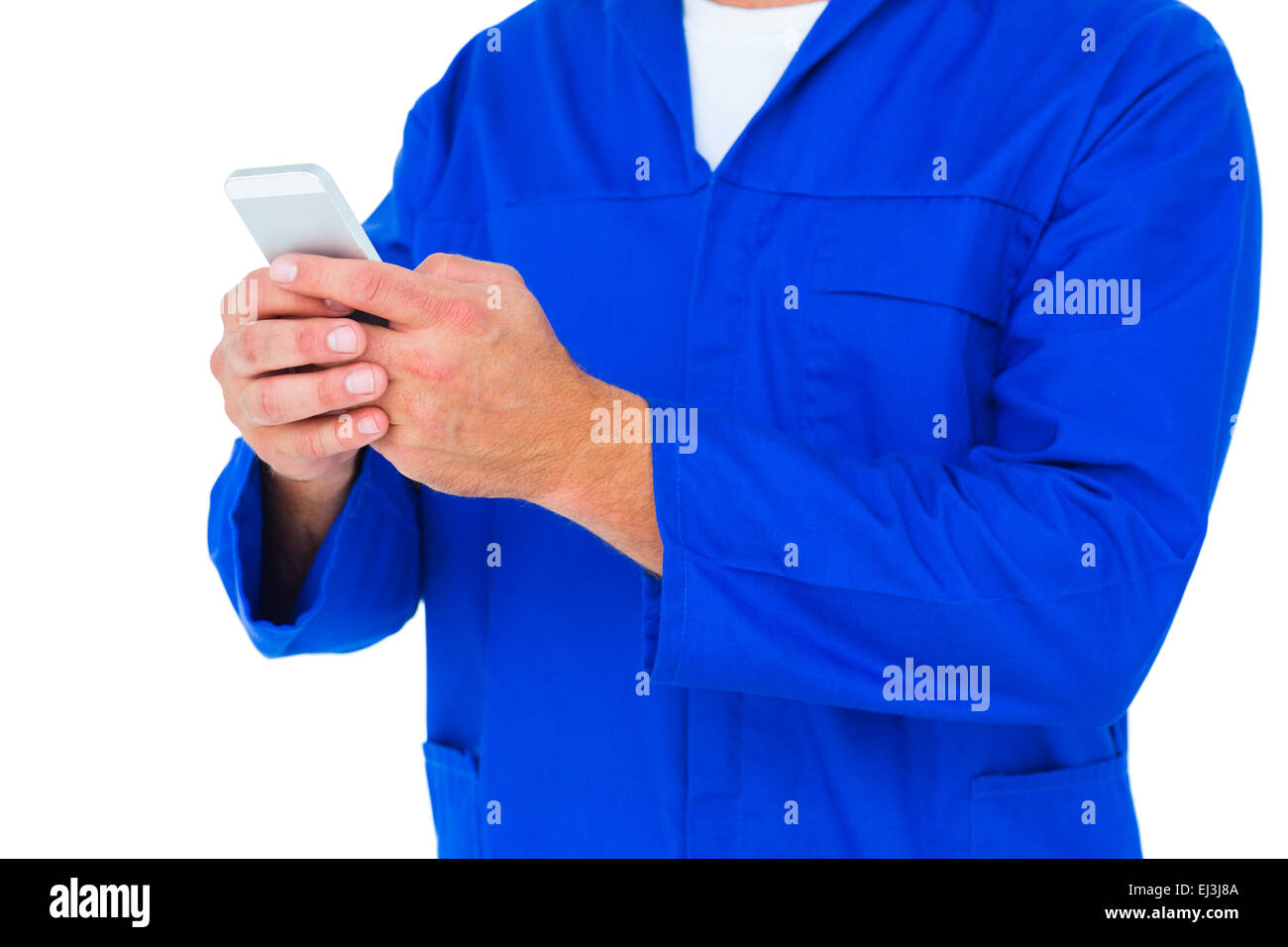 Mechaniker von SMS-Nachrichten über Mobiltelefon Stockfoto