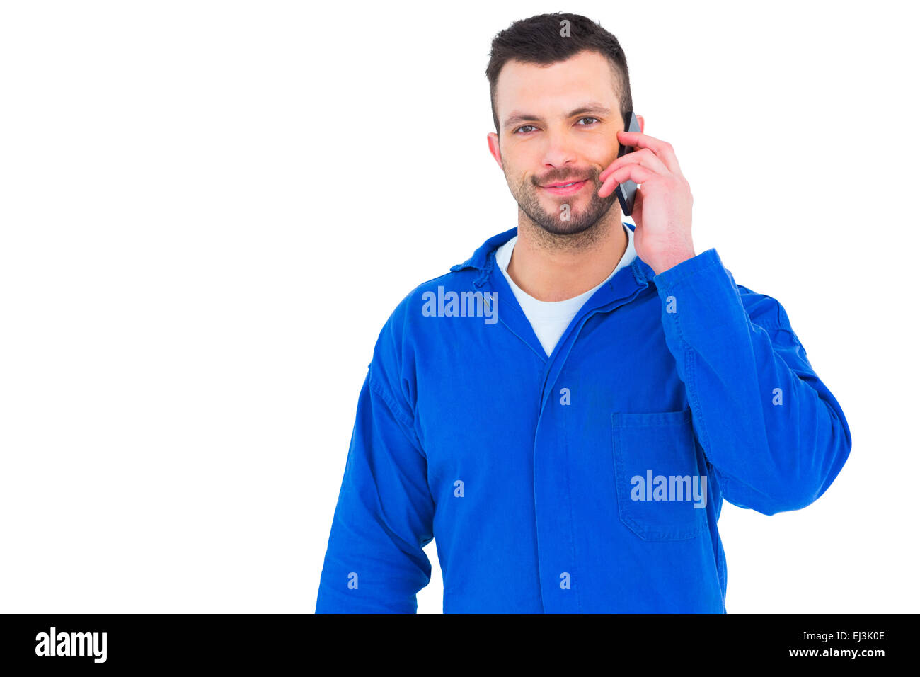 Lächelnde männlichen Mechaniker mit Handy Stockfoto