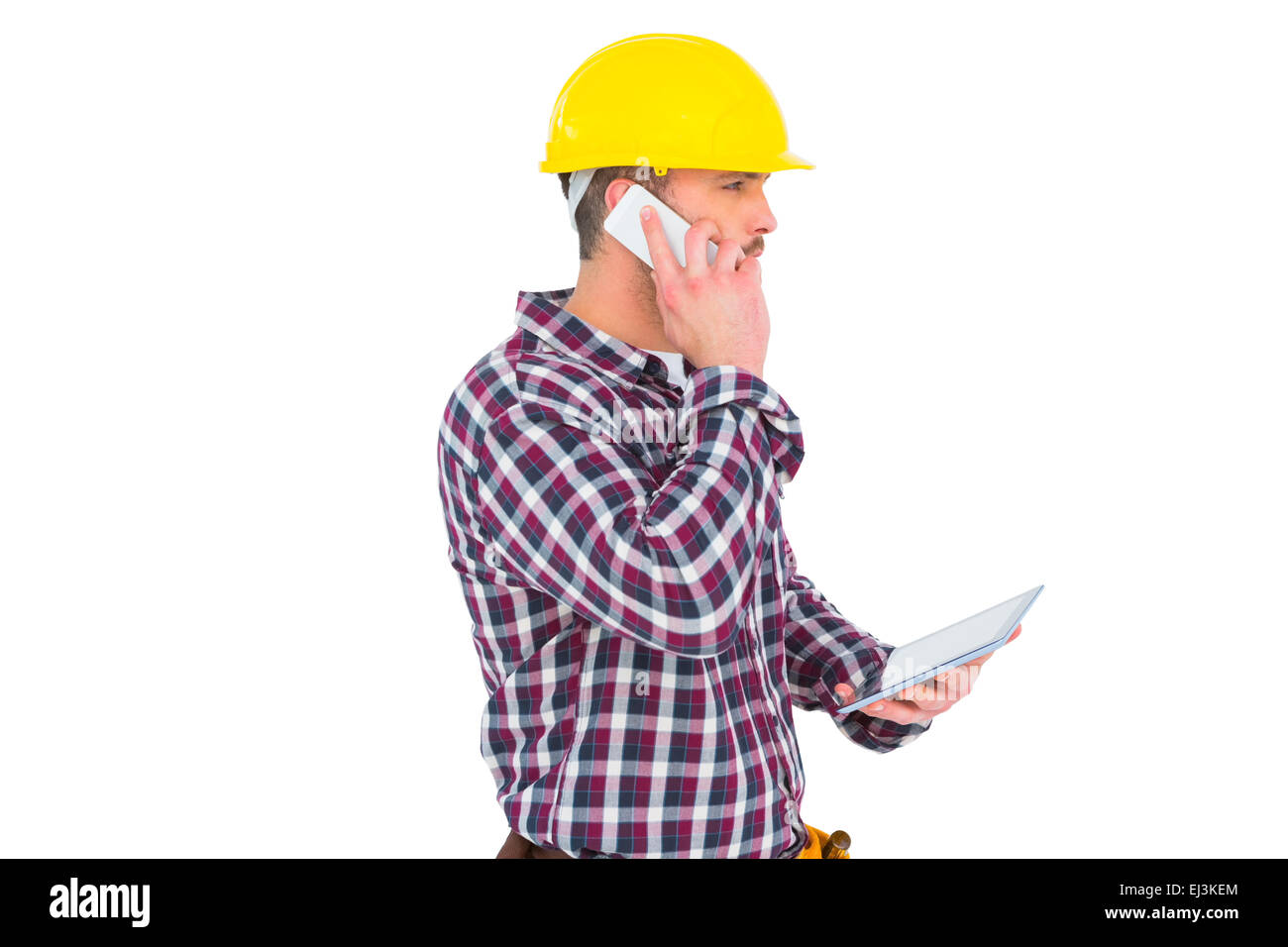 Mechaniker auf dem Handy, TabletPC halten Stockfoto