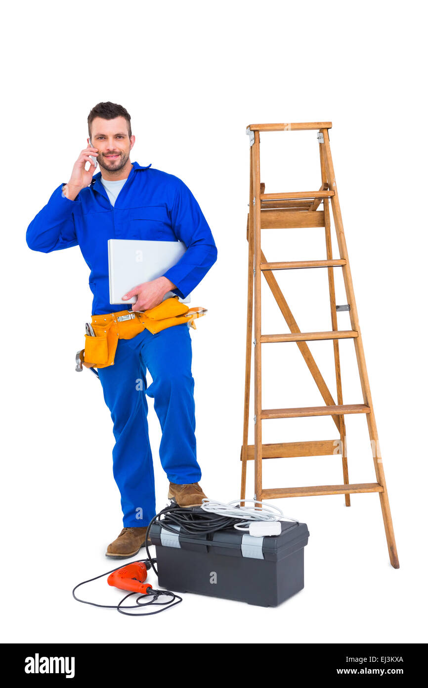 Tischler auf dem Handy Stockfoto