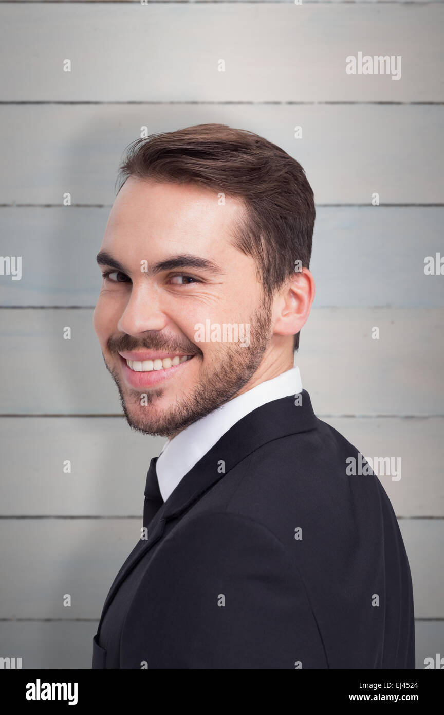 Zusammengesetztes Bild der eleganten Geschäftsmann im Anzug in die Kamera Lächeln Stockfoto