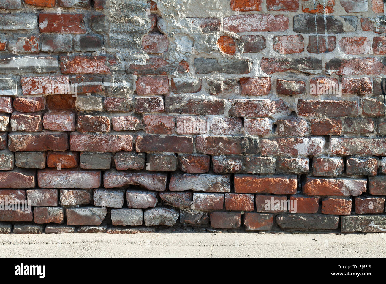 Hintergrundtextur des alten roten und dunklen grauen Mauer Stockfoto