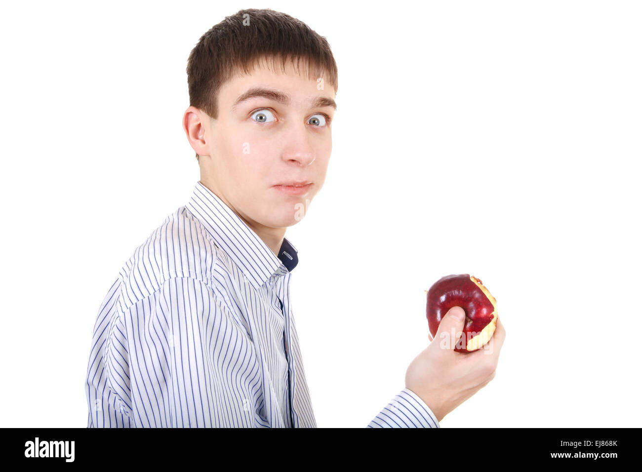 Überrascht Teenager mit einem Apfel Stockfoto