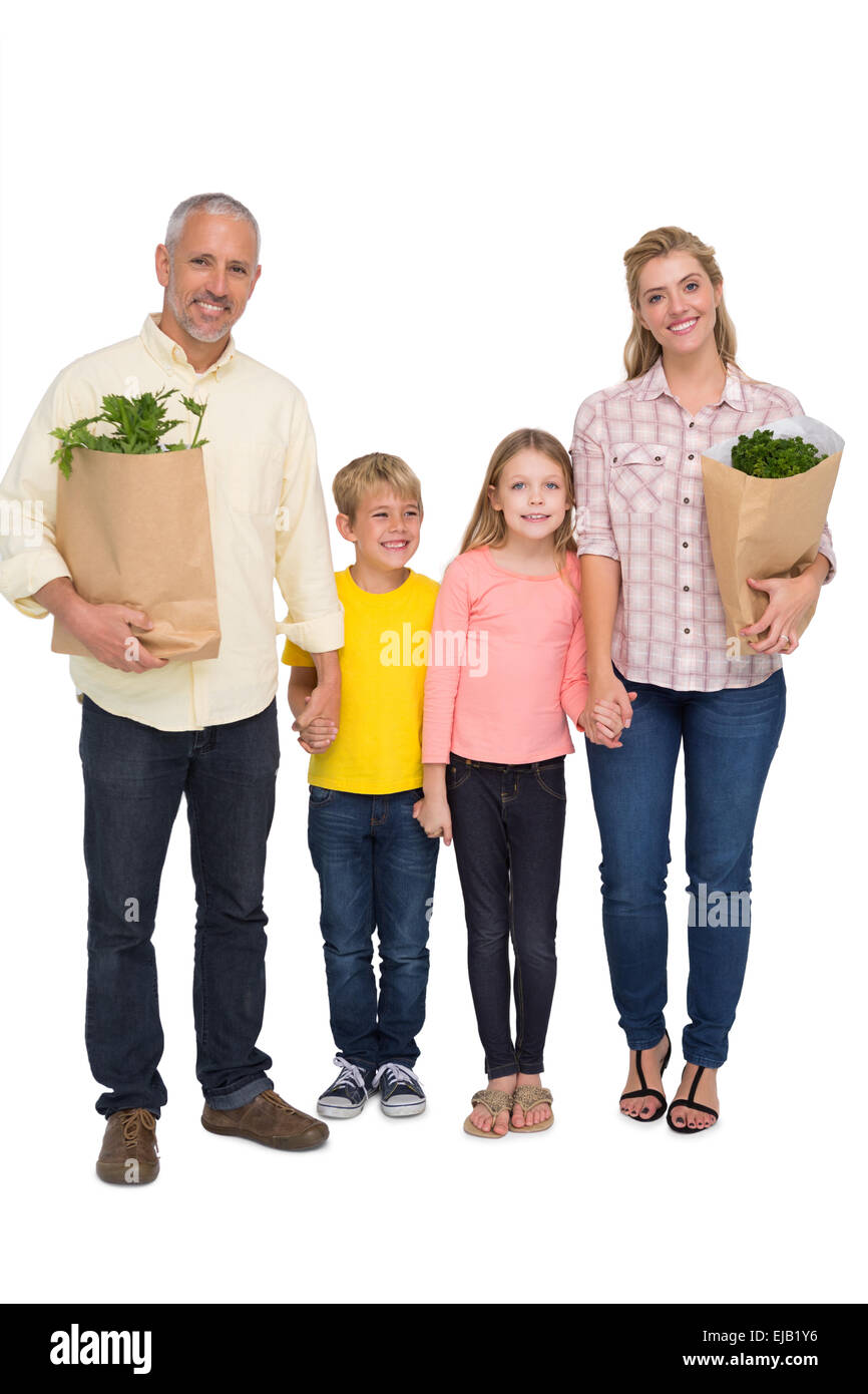 Glückliche Familie mit Einkaufstüten Stockfoto