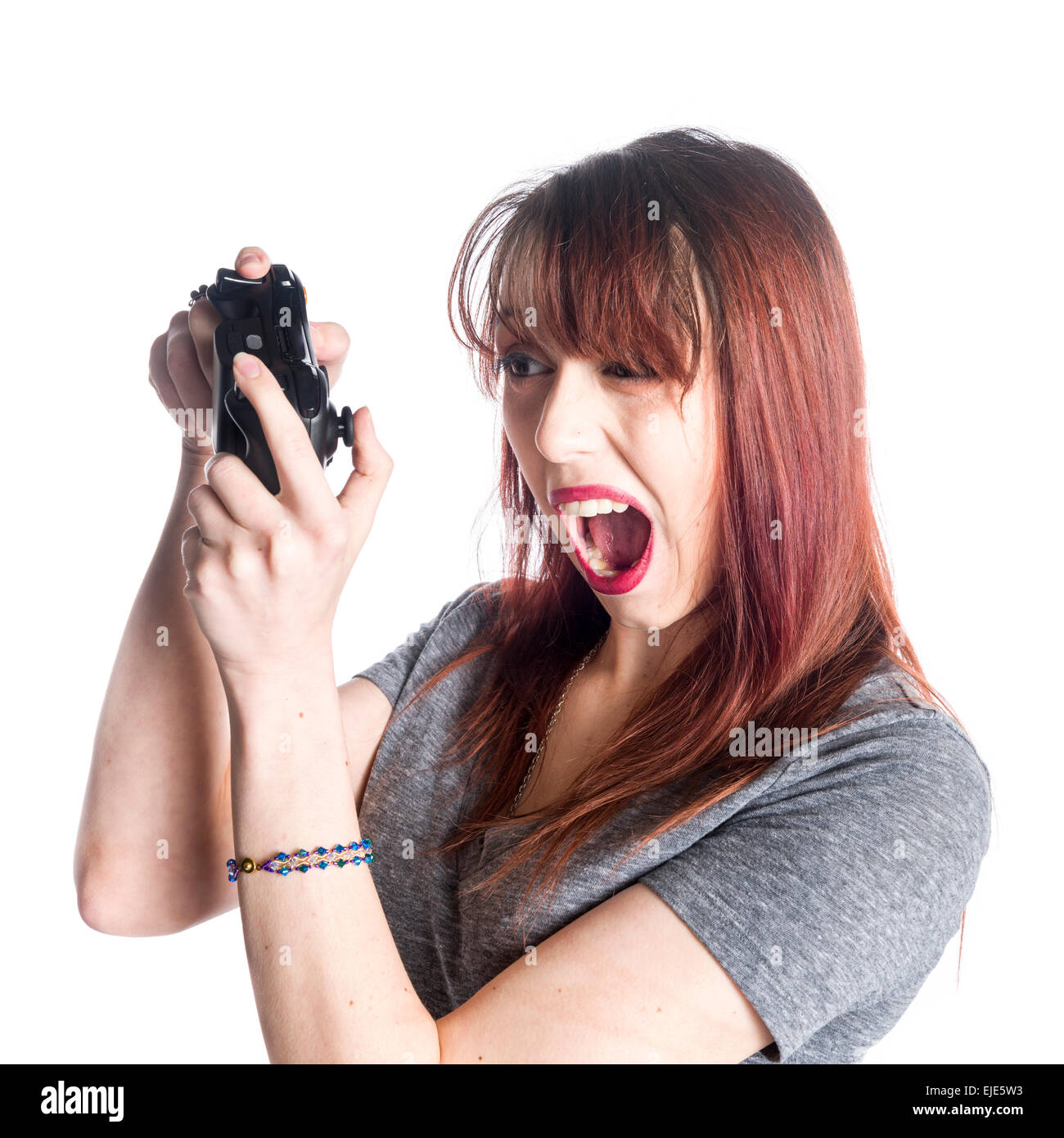 Junge Frau mit Videospiel-Joysticks Stockfoto