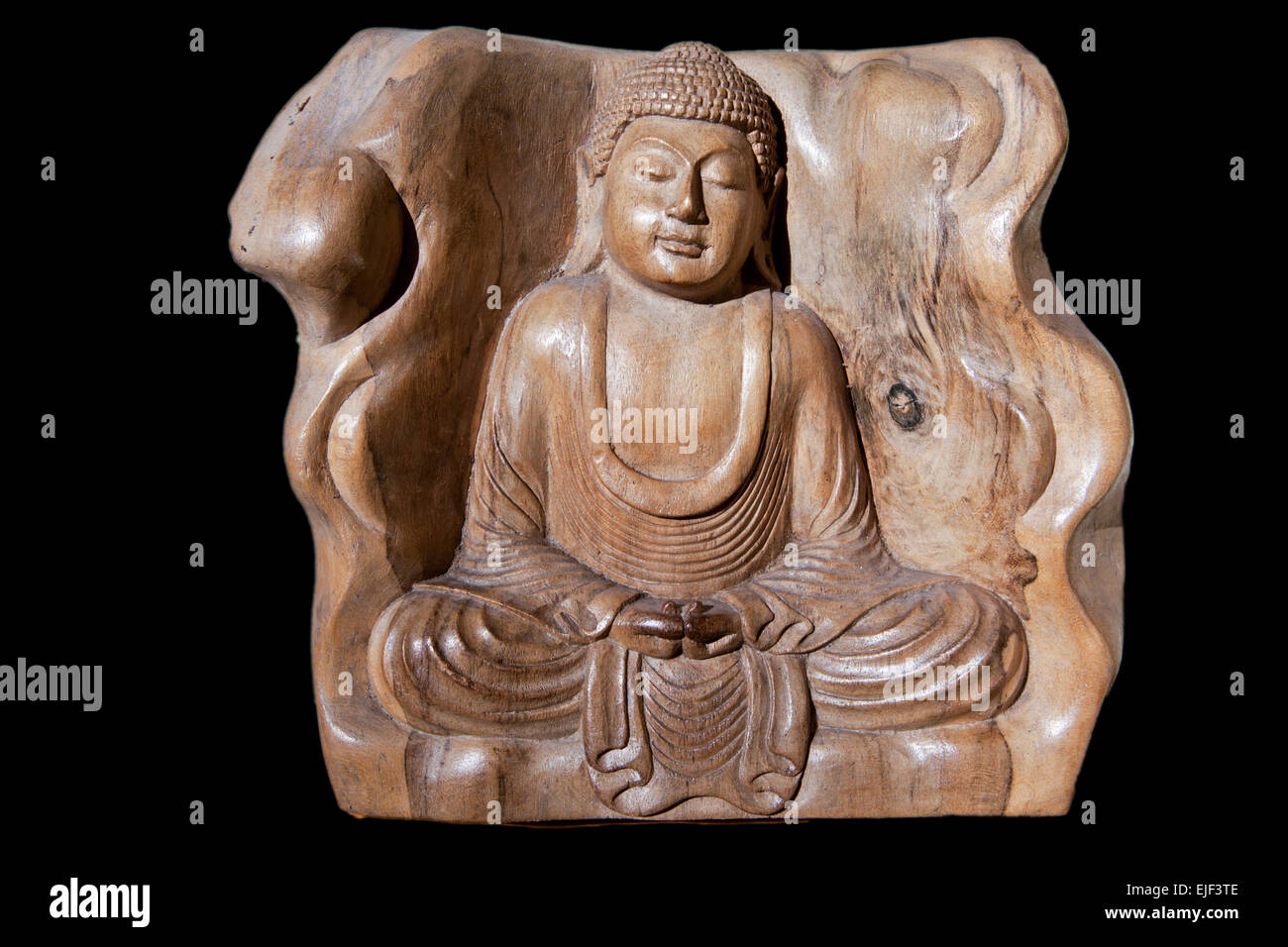 Holz Figur des Meditierenden Buddha isoliert. Geschnitzte Stockfoto