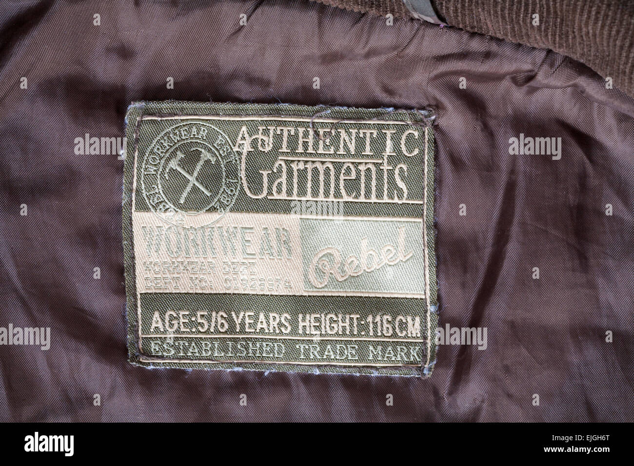Rebel Workwear authentische Bekleidung Label im Kindes-Mantel Stockfoto