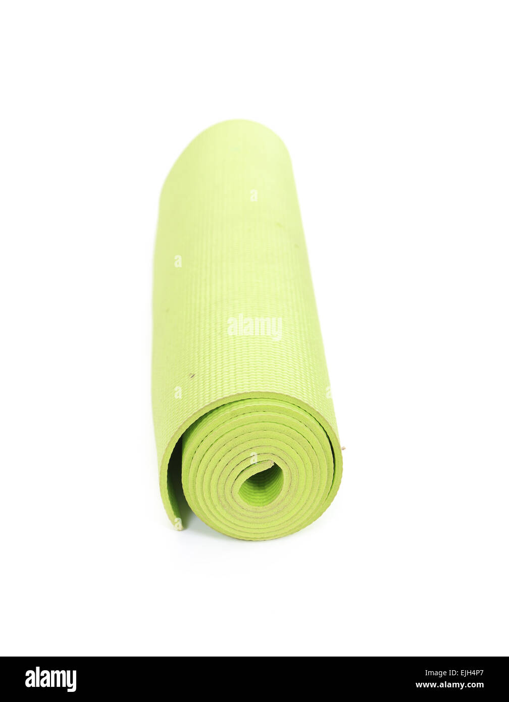 grüne Yogamatte auf weißem Hintergrund Stockfoto
