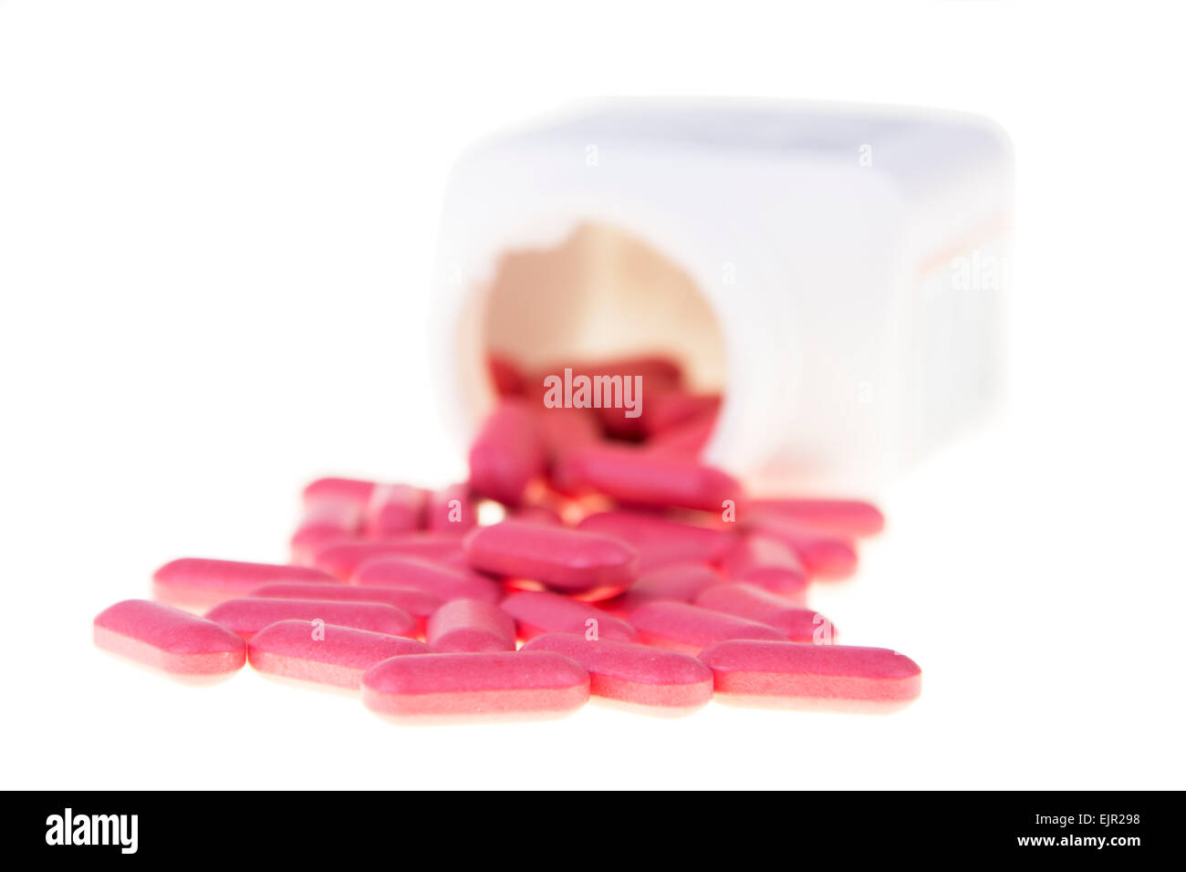 Rosa Vitamin isoliert auf weißem Hintergrund Stockfoto