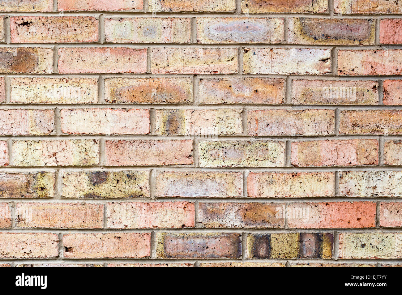 Eine rötliche Ziegel Wand Hintergrund Stockfoto