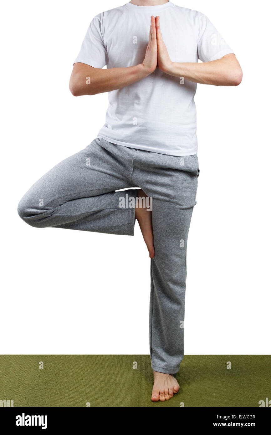 Junger Mann, Yoga zu praktizieren Stockfoto