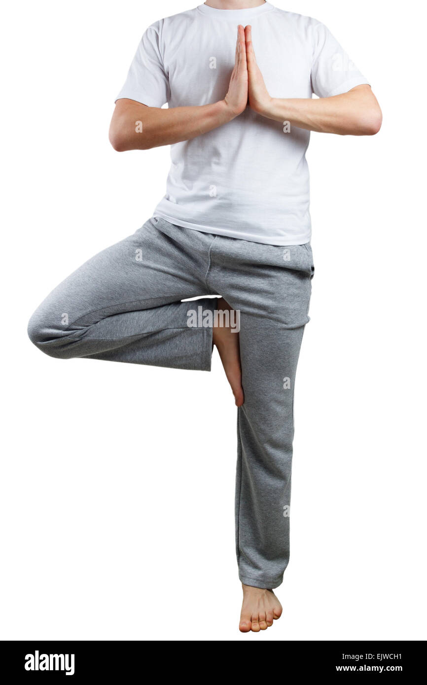 Junger Mann beim yoga Stockfoto