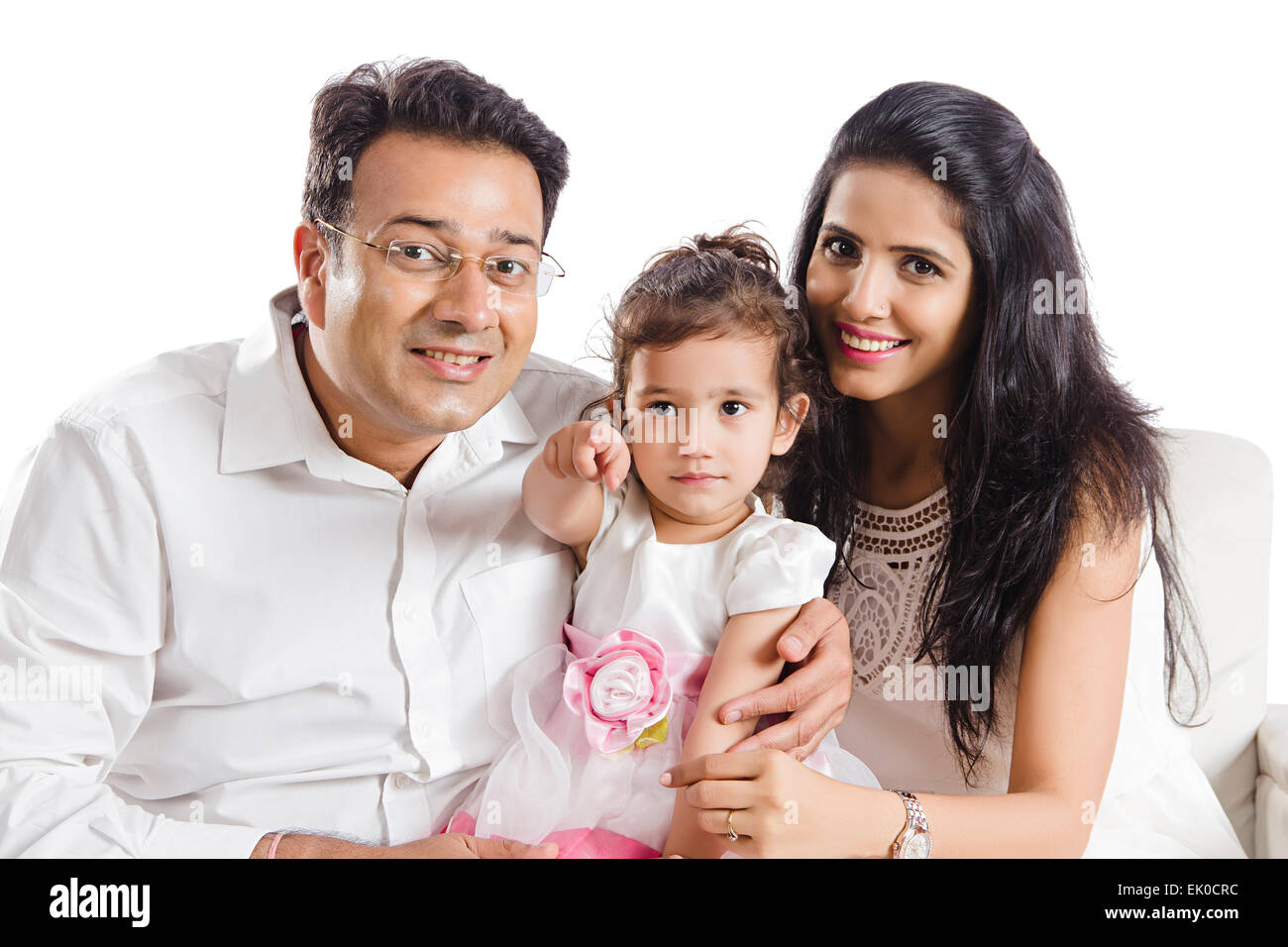 indische Eltern und Tochter sitzen Zuhause Stockfoto