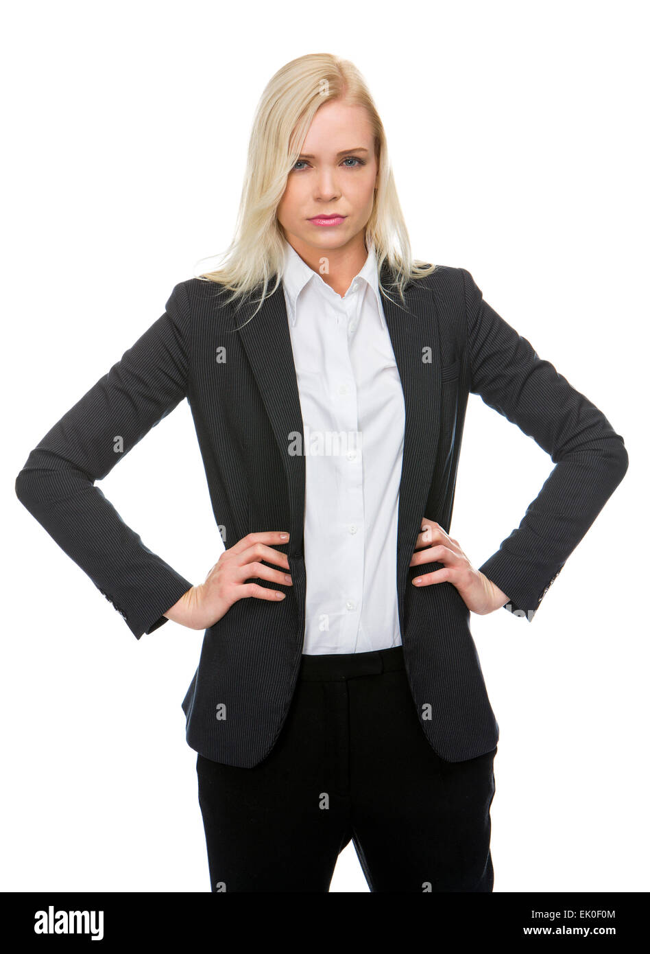 schwere blonde Geschäftsfrau mit Armen ruht auf der Hüfte Stockfoto