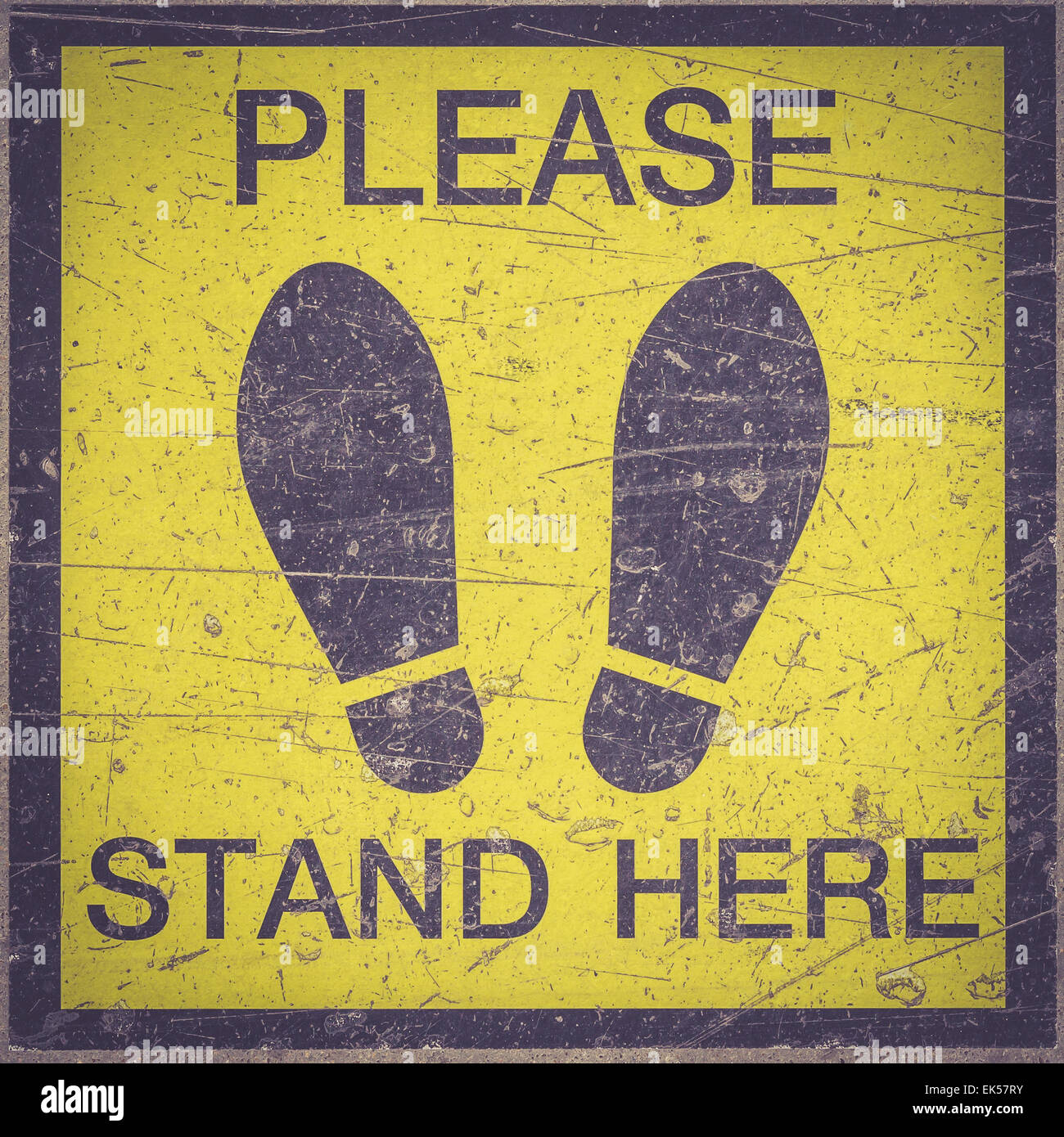 Bitte hier stehen Fuß Zeichen oder Symbol auf dem Boden, Retro-Filter-Effekt Stockfoto
