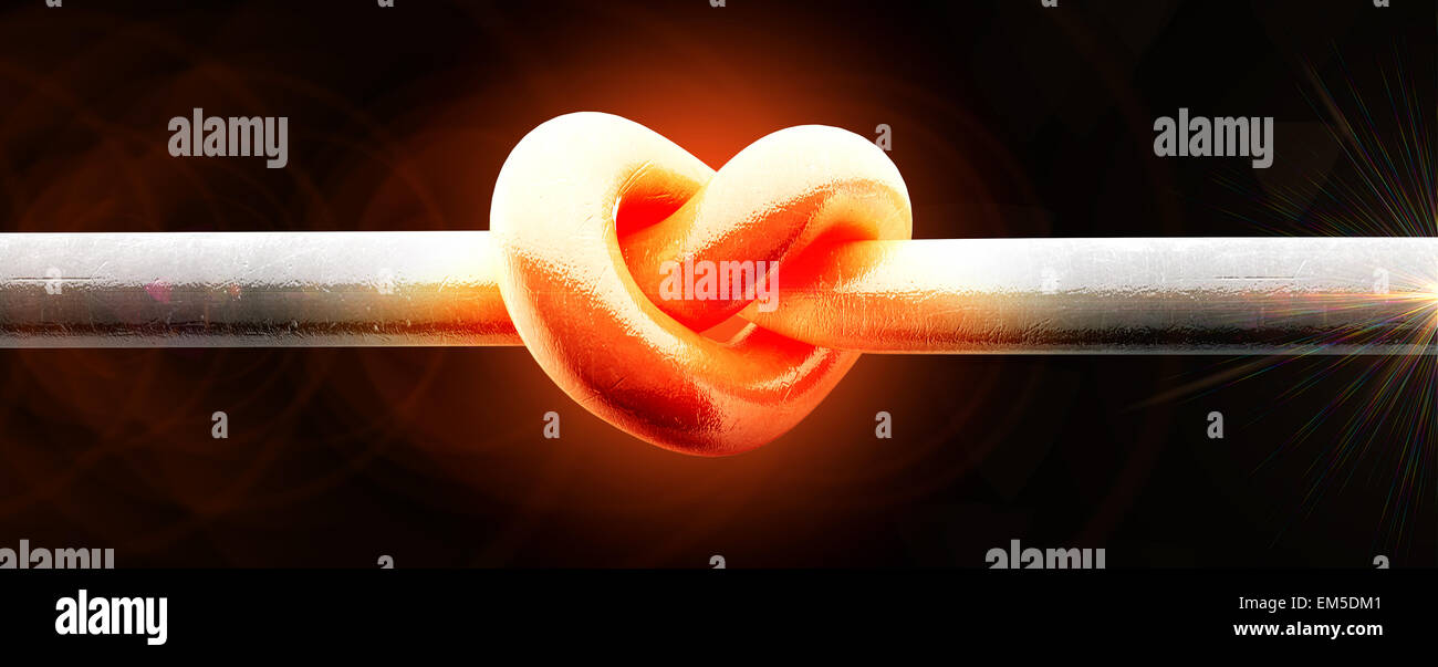 Eine Metallstange in eine geknotete Form, die ein Herz ähnelt dem rot glühend heiß auf einen isolierten Hintergrund ist verdreht Stockfoto