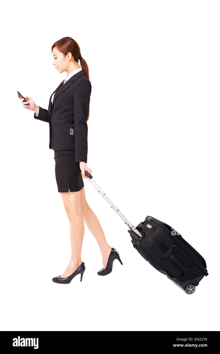 Geschäftsfrau, die Reisen mit Koffer isoliert Stockfoto