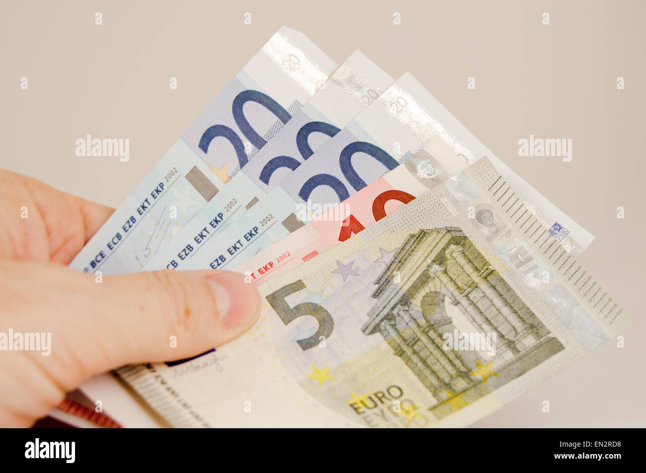 Hand, die Euro-Banknoten Stockfoto