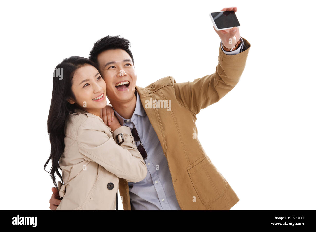 Junge Paare nutzen Handy-autodyne Stockfoto