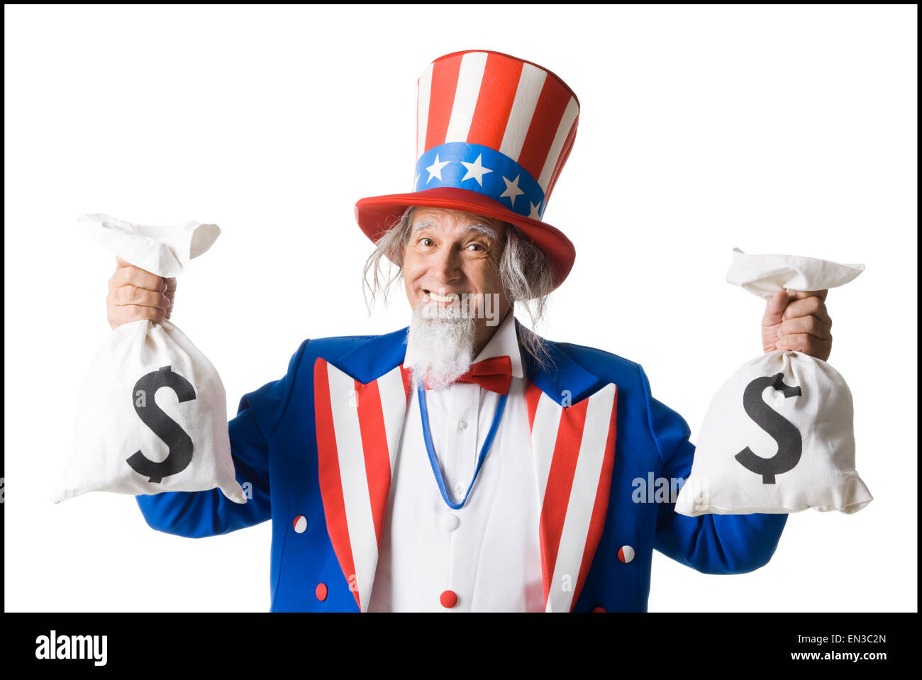 Uncle Sam hält zwei Säcke mit Geld Stockfoto