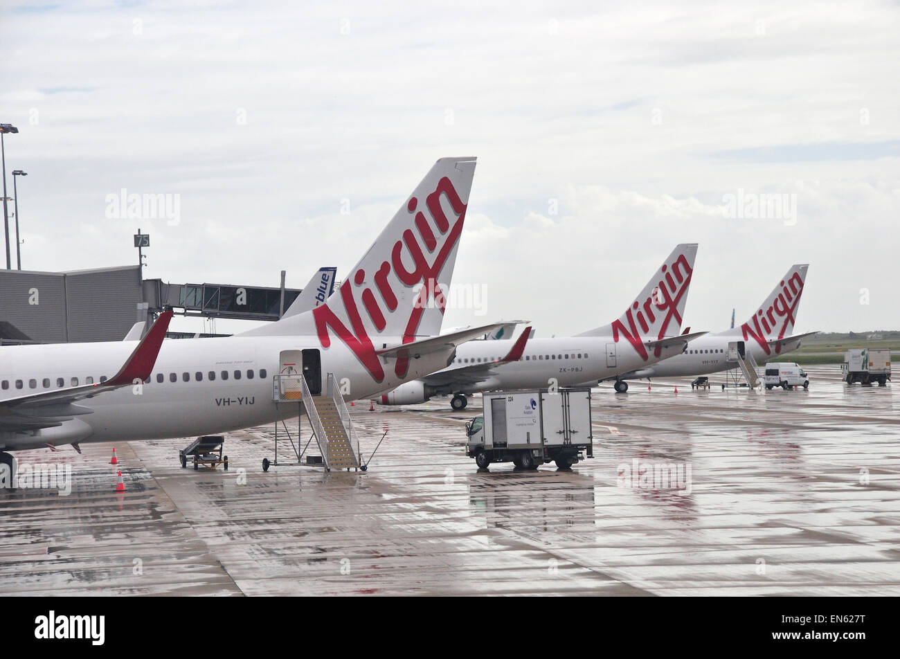 BRISBANE, Australien: März 8: Verkehrsflugzeuge von Virgin Airlines aufgereiht auf dem Rollfeld auf 03.08.2013 am Flughafen Brisbane Stockfoto