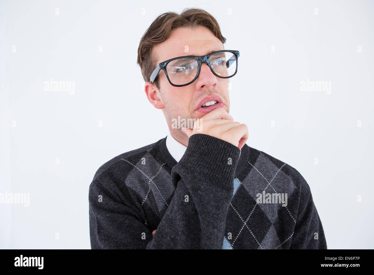 Geeky Hipster denken mit Hand am Kinn Stockfoto