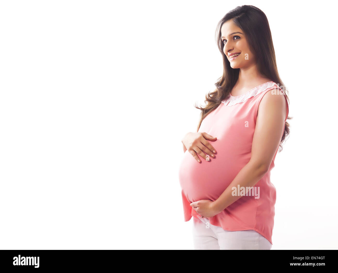 Schwangere Frau lächelnd Stockfoto