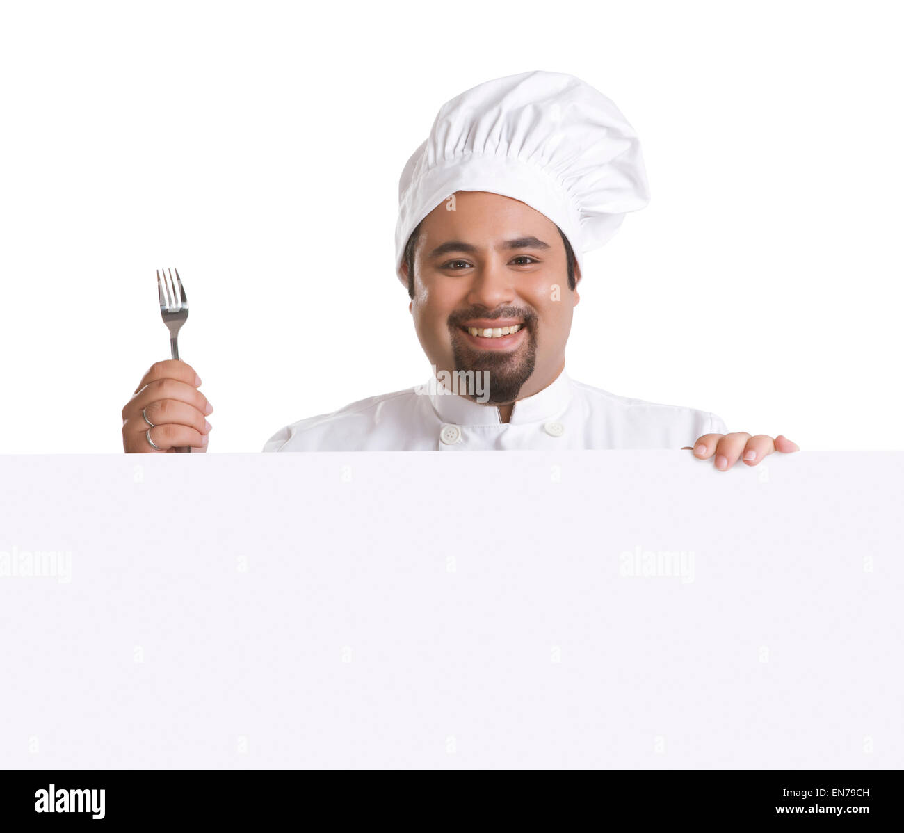 Porträt des Küchenchefs mit Gabel lächelnd Stockfoto