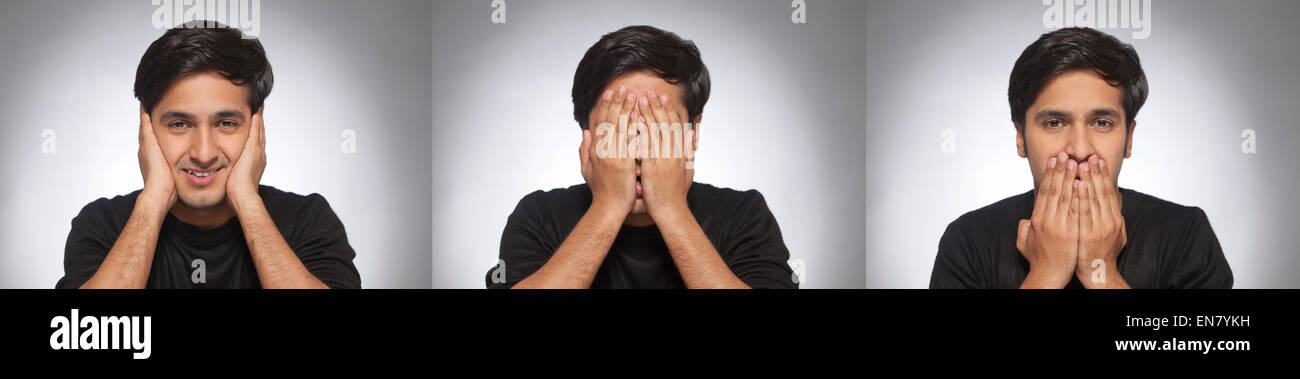 Porträt des jungen Mann posiert wie Ghandijis drei Affen Stockfoto