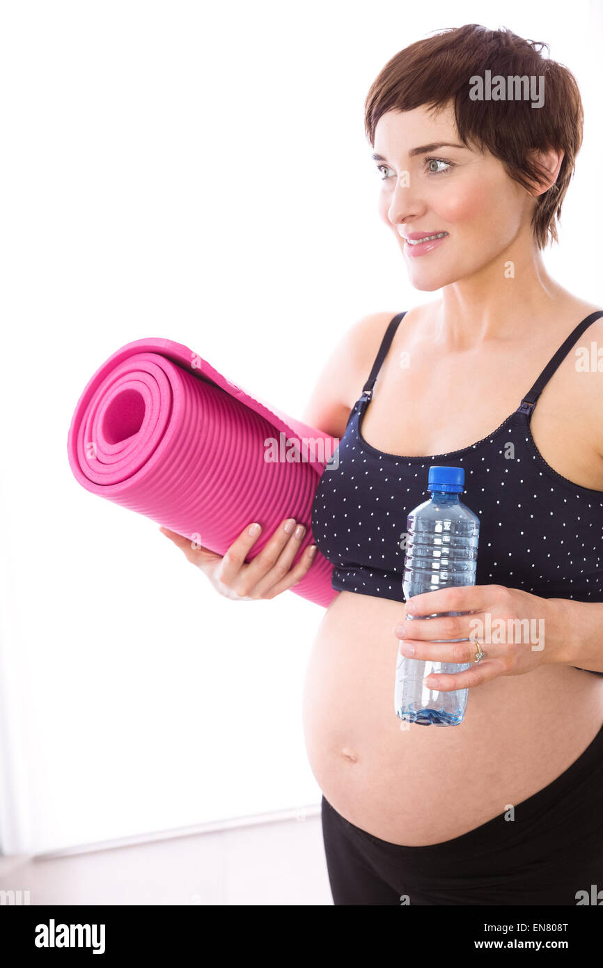 Schwangere Frau in Form halten Stockfoto
