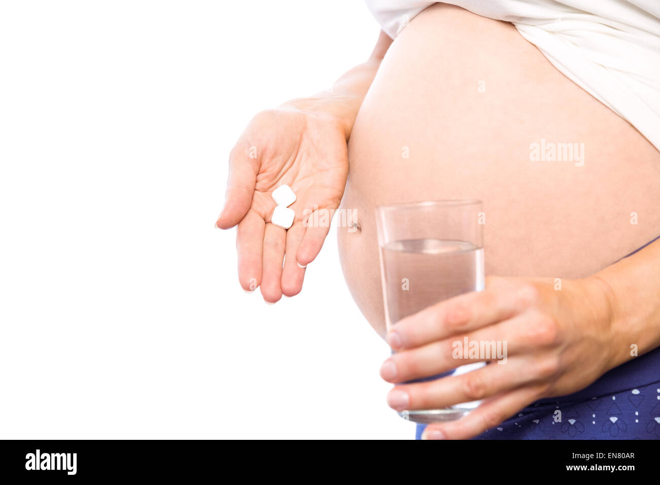 Schwangere Frau unter einem Vitamin-Tablette Stockfoto