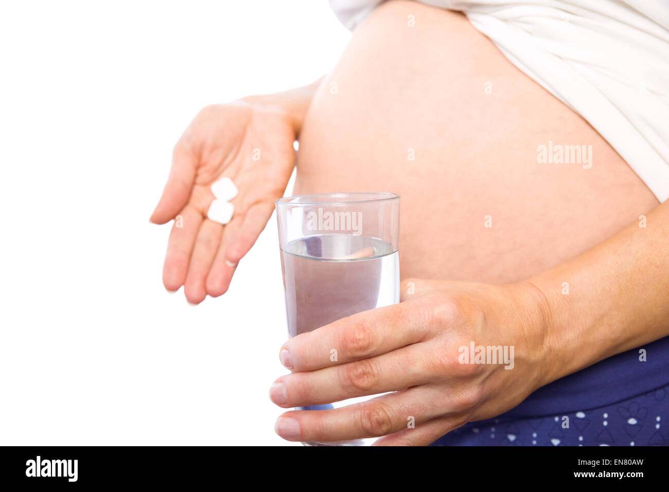 Schwangere Frau unter einem Vitamin-Tablette Stockfoto