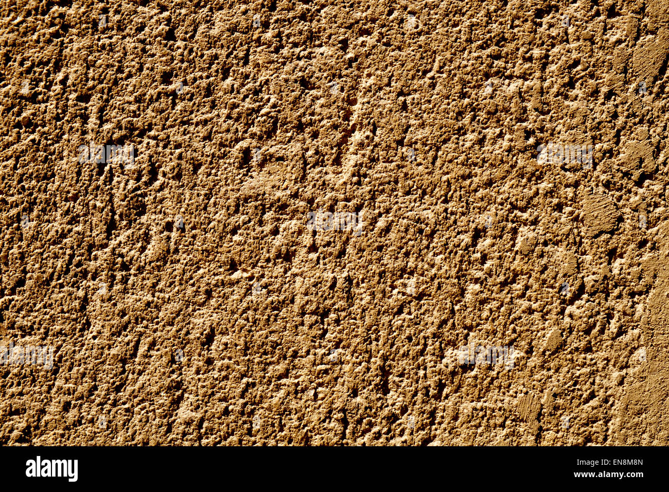 Nahaufnahme einer rustikalen Braun verputzten Wand Stockfoto